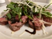 TAGLIATA DI MANZO RUCOLA E GRANA